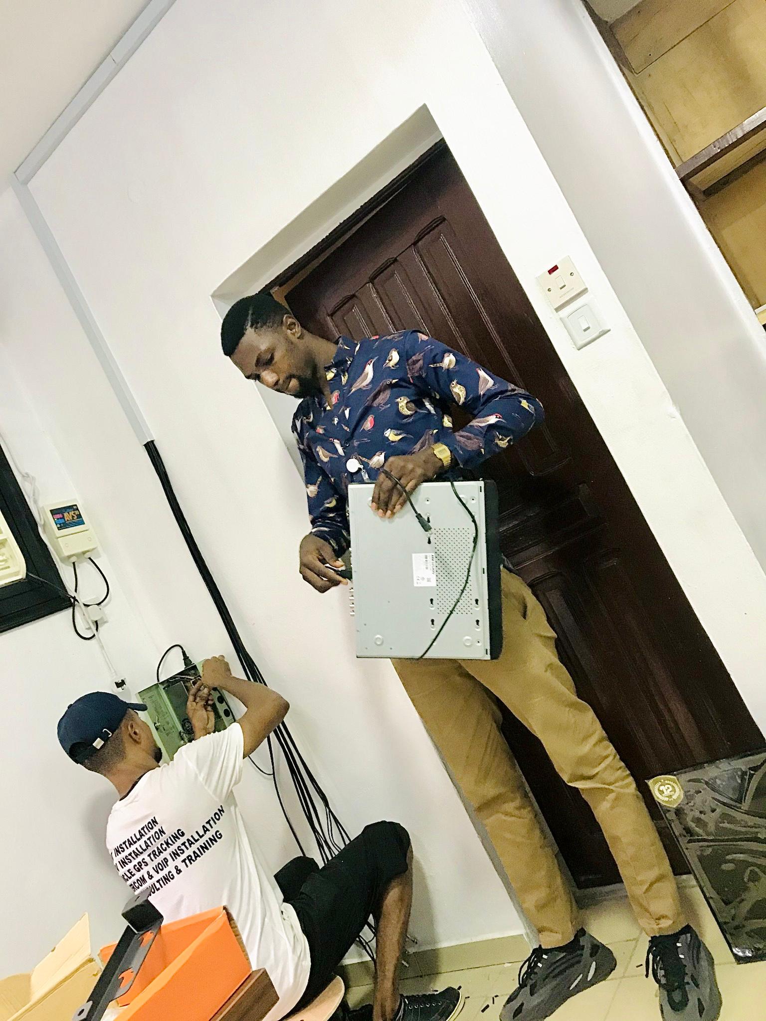 Team installing networking equipment